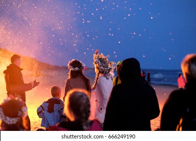 Celebrating the summer solstice on the shore of the Gulf of Riga. Latvia.