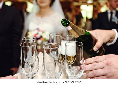 celebrating and toasting happy group of people with champagne at the  wedding reception