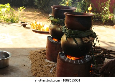 Celebrating Traditional Thai Pongal Festival To Sun God With Pot, Lamp,wood Fire Stove, Fruits And Sugarcane. Making Sakkarai Or Sugar Pongal And Ven Pongal In Sand Stove In Traditional Method.