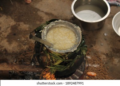 Celebrating Traditional Thai Pongal Festival To Sun God With Pot, Lamp,wood Fire Stove, Fruits And Sugarcane. Making Sakkarai Or Sugar Pongal And Ven Pongal In Sand Stove In Traditional Method.