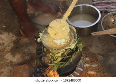 Celebrating Traditional Thai Pongal Festival To Sun God With Pot, Lamp,wood Fire Stove, Fruits And Sugarcane. Making Sakkarai Or Sugar Pongal And Ven Pongal In Sand Stove In Traditional Method.