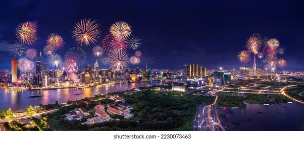 Celebration. Aerial view with fireworks light up sky over business district in Ho Chi Minh City( Saigon ), Vietnam. Beautiful night view cityscape. Holidays, independence day, New Year and Tet holiday