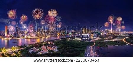 Celebration. Aerial view with fireworks light up sky over business district in Ho Chi Minh City( Saigon ), Vietnam. Beautiful night view cityscape. Holidays, independence day, New Year and Tet holiday