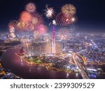 Celebration. Aerial view of Landmark 81 skyscraper with fireworks light up sky over business district in Ho Chi Minh City, Vietnam. Saigon bridge in night view. Holidays, celebrating New Year