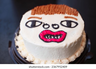 Celebration birthday cake shape ugly man face. not good cake