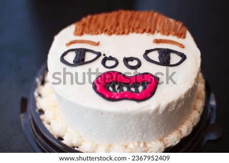 Celebration birthday cake shape ugly man face. not good cake