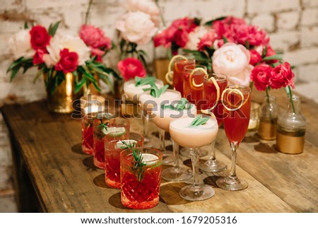 A celebration designed in pink colors with alcoholic drink complementing the party theme