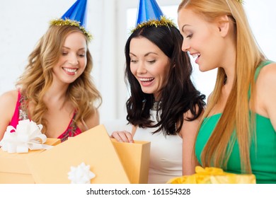 Celebration, Friends, Bachelorette Party, Birthday Concept - Three Smiling Women Wearing Blue Hats With Gift Boxes