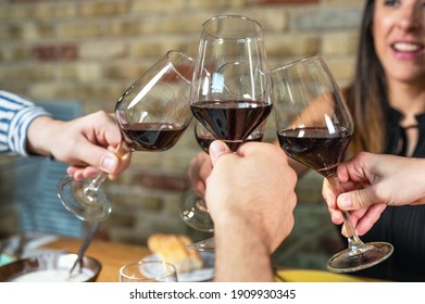 Celebration. Group Of Friends Holding The Glasses Of Wine Making A Toast. High Quality Photo