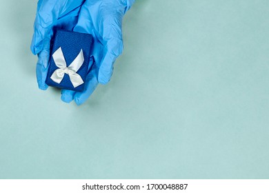 Celebration holiday, birthday in hospital. Doctor giving giftbox to patient or Healthcare worker receiving present from patient. Celebrating birthday in quarantine during covid-19 pandemic - Powered by Shutterstock