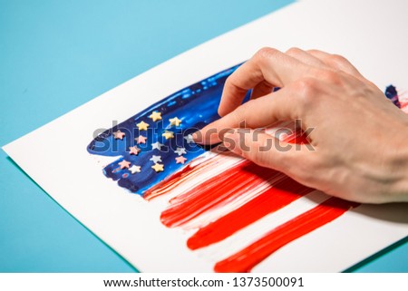 Celebration of independence day  of America, woman hand painting american flag