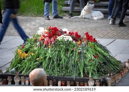 Celebration of May 9 Victory Day in Vilnius, Lithuania Antakalnio cemetery with lots of flowers and candles instead of eternal fire