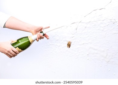 Celebration Moment: Champagne Bottle Being Popped with Bubbles and Cork Flying - Powered by Shutterstock