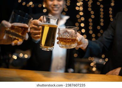 Celebration night, pour whiskey into a glass. Give to friends who come to celebrate - Powered by Shutterstock