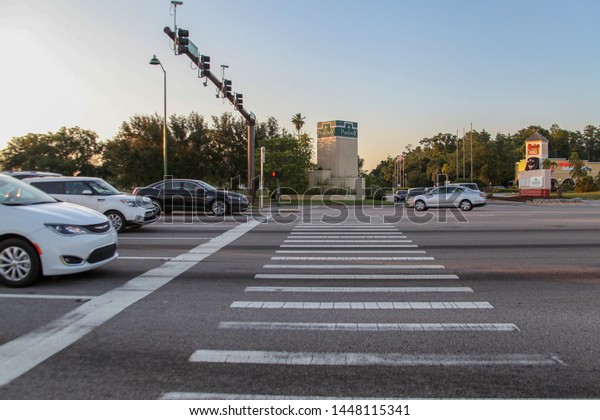 Celebration, Orlando, Florida, USA, July 12,\
2019: Highways and avenues, city planning projects, signposts, pass\
through major city districts, connected to Walt Disney World parks\
and resorts.