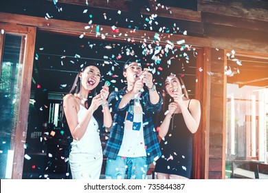 Celebration Party Group Of Asian Young People Holding Confetti Happy And Funny Concept