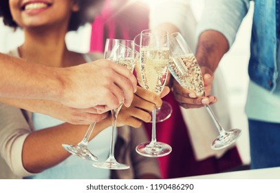celebration, people and holidays concept - close up of happy friends clinking glasses of champagne at party
