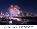 Celebration. Skyline with fireworks light up sky over business district in Ho Chi Minh City ( Saigon ), Vietnam. Beautiful night view cityscape. Holidays, celebrating New Year and Tet holiday