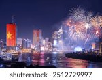 Celebration. Skyline with fireworks light up sky over business district in Ho Chi Minh City ( Saigon ), Vietnam. Beautiful night view cityscape. Holidays, celebrating New Year and Tet holiday