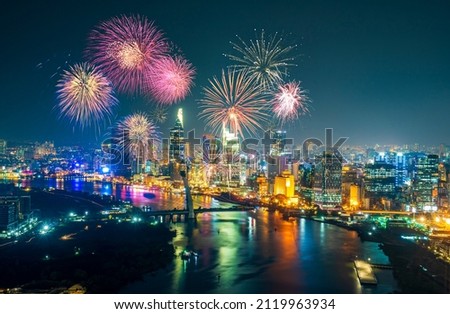 Celebration. Skyline with fireworks light up sky over business district in Ho Chi Minh City ( Saigon ), Vietnam. Beautiful night view cityscape. Holidays, celebrating New Year and Tet holiday