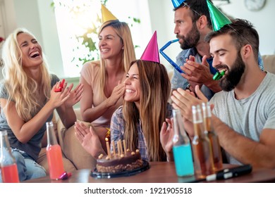 Celebration,friends, Party And Birthday Concept - Smiling Women Blows Candles On Her Birthday Cake.