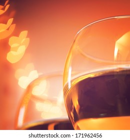 Celebration.Glasses of wine. The concept of Valentine's Day. Bokeh in the background of glasses are shaped like heart. - Shutterstock ID 171962456