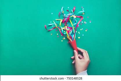 Celebration,party Backgrounds Concepts Ideas With Hand Holding Colorful Confetti,streamers.Flat Lay Design
