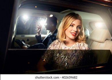Celebrity couple in back of a car, photographed by paparazzi - Shutterstock ID 402639682