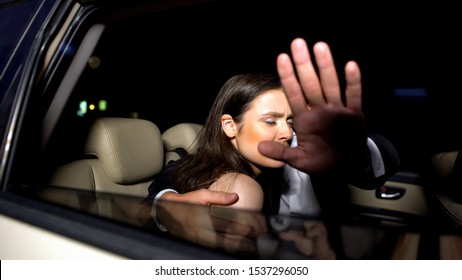 Celebrity Couple In Car Hiding With Hand From Magazine Photographers Cameras