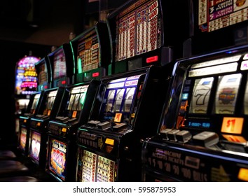 CELEBRITY CRUISES, ROME, ITALY - MARCH 10: Celebrity Cruises casino machines in the ship entertainment area at night on 10 of March in Rome, 2016.  - Shutterstock ID 595875953