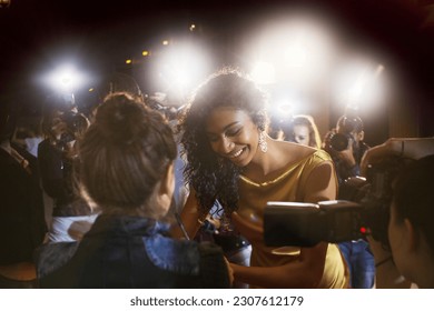 Celebrity signing autographs for fans at event - Shutterstock ID 2307612179