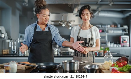 Celebrity TV Cooking Show Kitchen: Asian And Black Female Chefs Talk, Teach How To Cook Food. Online Video Courses, Television Program Presenters. Preparation Of Healthy Traditional Fusion Dish Recipe