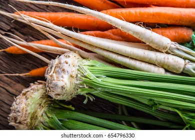 Celery Carrot And Parsnip On Rustic Oak Table.