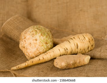 celery, parsley root and ginger on burlap background