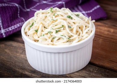 Celery Root Remoulade salad julienned celeriac with a Dijon mustard dressing on a rustic table - Shutterstock ID 2174364003