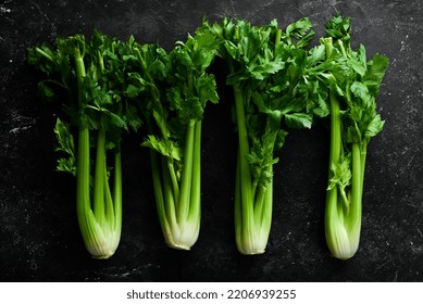 Celery Stalk With Green Leaves. Organic Healthy Food On Stone Background. Top View. Free Space For Text.