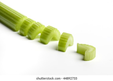 Celery Stem Cut Into Pieces On White Background