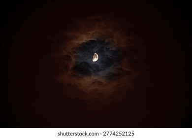 a celestial scene featuring a half moon partially obscured by surrounding clouds