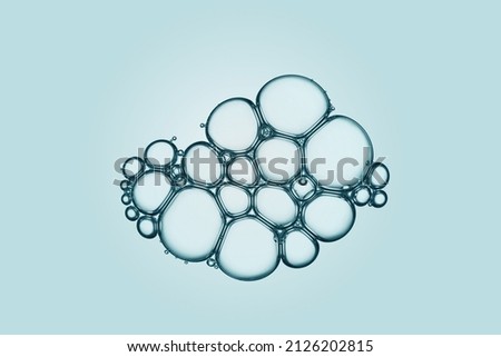 Cell, molecule concept. Air bubbles group macro representing abstract cell structure microscope view. Blue science, chemistry background