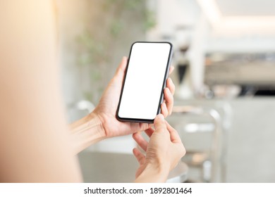 Cell Phone Blank White Screen Mockup.woman Hand Holding Texting Using Mobile On Desk At Office.background Empty Space For Advertise.work People Contact Marketing Business,technology