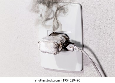 cell phone charger short-circuited, smoke and fire, electrical appliance melting