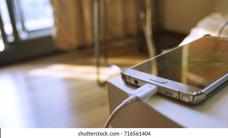 Cell Phone Charging On Table 