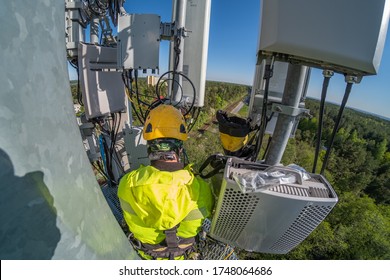 Cell Phone Installers Work On The Tower