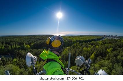 Cell Phone Installers Work On The Tower