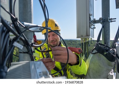 Cell Phone Installers Work On The Tower