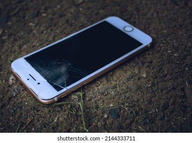 Cell Phone Or Mobile With The Split Screen On The Ground