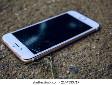 Cell Phone Or Mobile With The Split Screen On The Ground