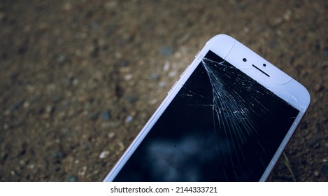 Cell Phone Or Mobile With The Split Screen On The Ground