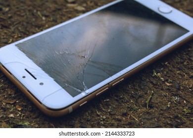 Cell Phone Or Mobile With The Split Screen On The Ground