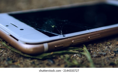 Cell Phone Or Mobile With The Split Screen On The Ground